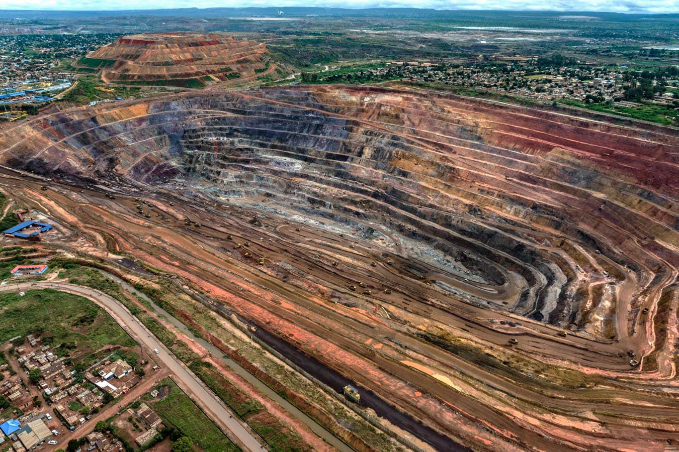 Aerial view of a large African open-pit cobalt and copper mine showing the scale and environmental impact of resource extraction